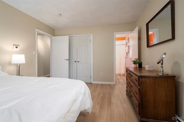 1 Christopher Cir, New Hartford, NY 13413 - bedroom with light wood finished floors, baseboards, and a closet