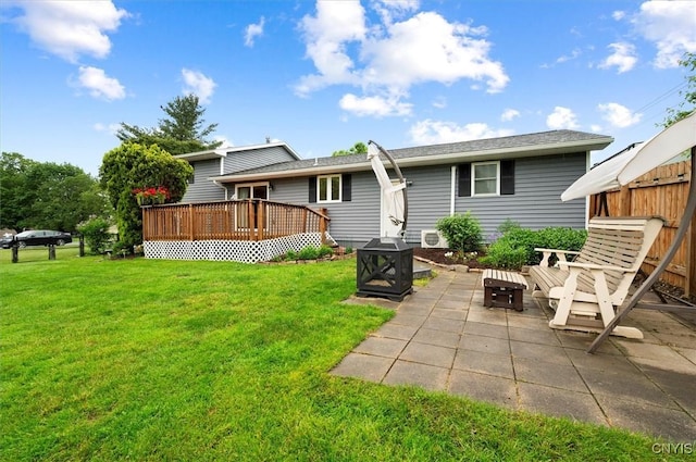 1 Christopher Cir, New Hartford, NY 13413 - back of property featuring an outdoor fire pit, a deck, a yard, and a patio area