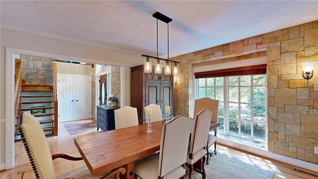 11 Sunrise Park, Pittsford, NY 14534 - dining area featuring ornamental molding, a textured ceiling, and light wood finished floors