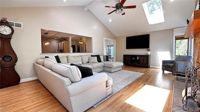 11 Sunrise Park, Pittsford, NY 14534 - living area featuring high vaulted ceiling, beam ceiling, baseboards, ceiling fan, and light wood-style floors