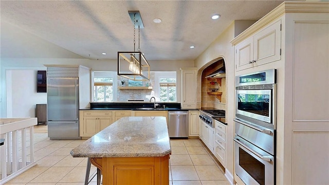 11 Sunrise Park, Pittsford, NY 14534 - kitchen featuring built in appliances, a sink, a center island, light tile patterned floors, and recessed lighting