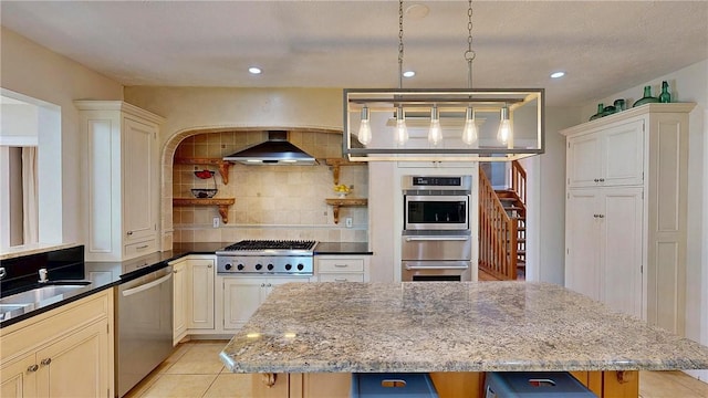 11 Sunrise Park, Pittsford, NY 14534 - kitchen with stainless steel appliances, wall chimney range hood, decorative backsplash, a kitchen island, and a warming drawer