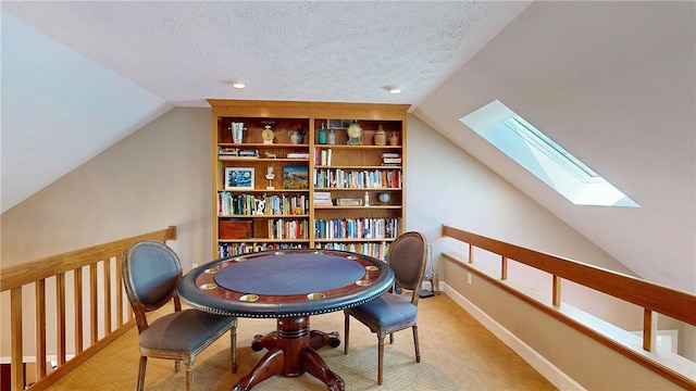 11 Sunrise Park, Pittsford, NY 14534 - sitting room with a skylight, vaulted ceiling, carpet floors, a textured ceiling, and an upstairs landing