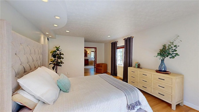 11 Sunrise Park, Pittsford, NY 14534 - bedroom with light wood finished floors, recessed lighting, and baseboards