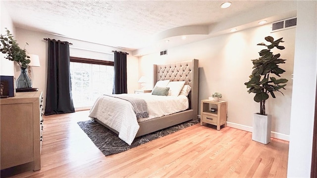 11 Sunrise Park, Pittsford, NY 14534 - bedroom featuring a textured ceiling, light wood-style floors, recessed lighting, and baseboards