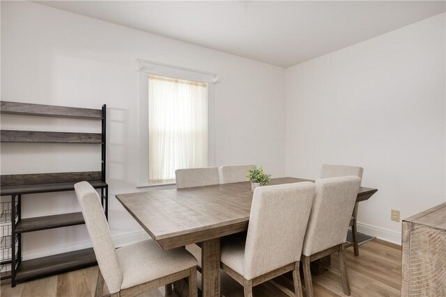 39 Sunnyside Dr, Elmira, NY 14905 - dining space with light wood finished floors and baseboards