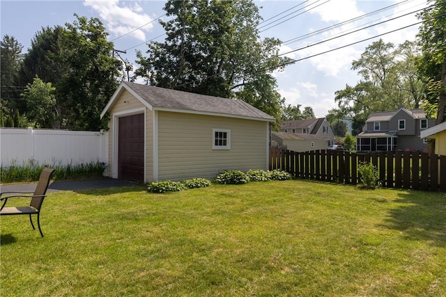 39 Sunnyside Dr, Elmira, NY 14905 - view of yard with an outbuilding, a garage, and driveway