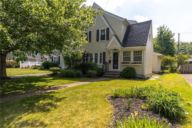 39 Sunnyside Dr, Elmira, NY 14905 - view of front of home featuring a front lawn, a shingled roof, and entry steps