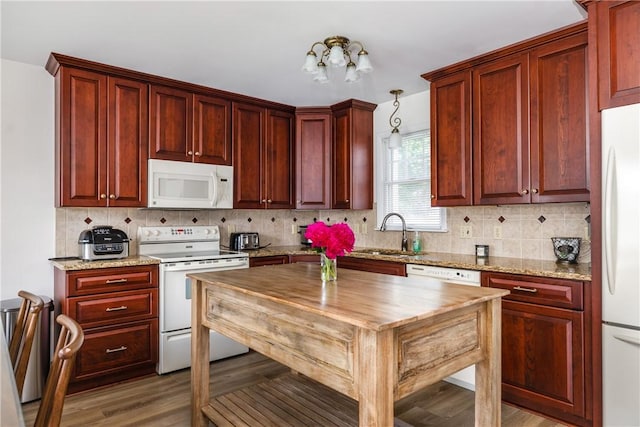 39 Sunnyside Dr, Elmira, NY 14905 - kitchen with white appliances, a sink, wood counters, and backsplash