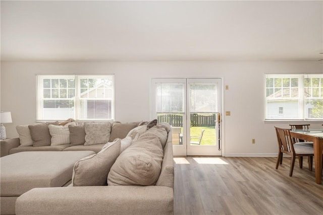 39 Sunnyside Dr, Elmira, NY 14905 - living room featuring light wood-style floors, healthy amount of natural light, and baseboards