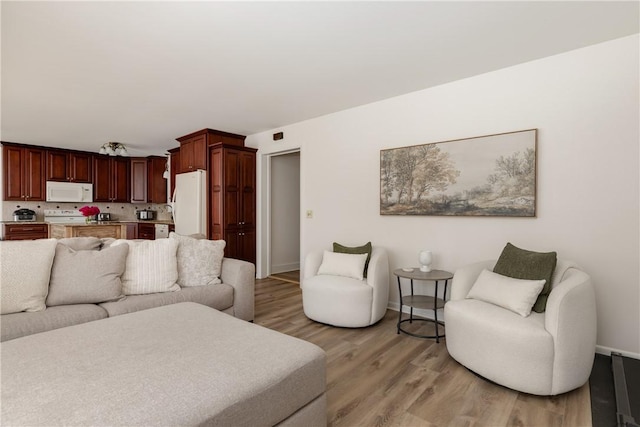 39 Sunnyside Dr, Elmira, NY 14905 - living area featuring baseboards and light wood-style floors