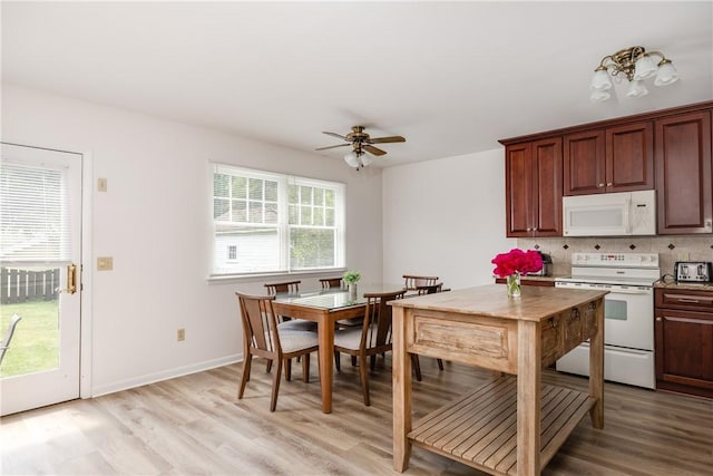 39 Sunnyside Dr, Elmira, NY 14905 - kitchen with white appliances, light wood-style flooring, a ceiling fan, and tasteful backsplash