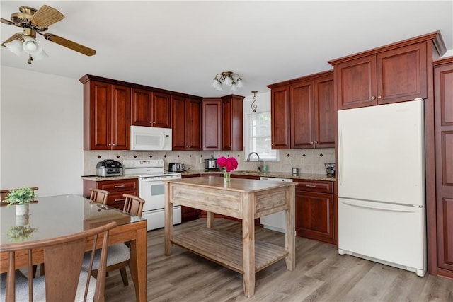 39 Sunnyside Dr, Elmira, NY 14905 - kitchen with white appliances, backsplash, and light wood-style flooring