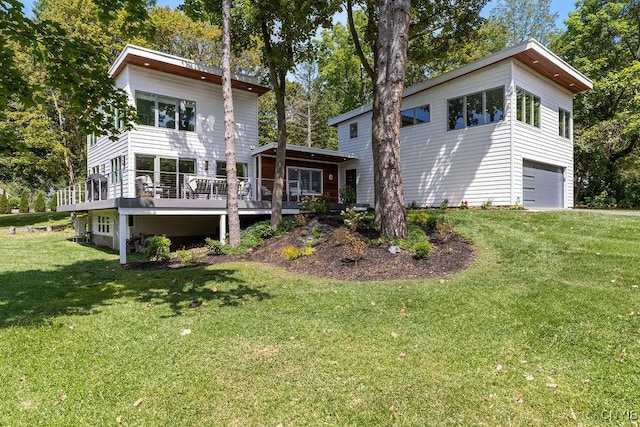3 Elson Ln, Skaneateles, NY 13152 - back of property featuring an attached garage and a lawn