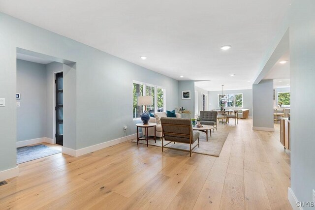 3 Elson Ln, Skaneateles, NY 13152 - living room featuring light wood finished floors, healthy amount of natural light, baseboards, and recessed lighting