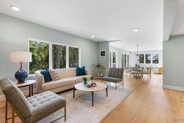 3 Elson Ln, Skaneateles, NY 13152 - living area featuring a chandelier, light wood-style floors, recessed lighting, and baseboards