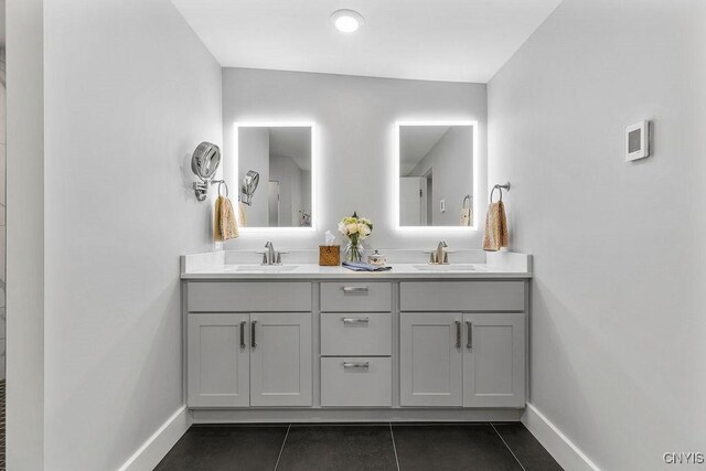 3 Elson Ln, Skaneateles, NY 13152 - bathroom with double vanity, tile patterned floors, and baseboards