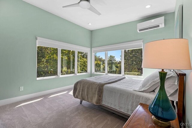 3 Elson Ln, Skaneateles, NY 13152 - carpeted bedroom with a wall unit AC, a ceiling fan, and recessed lighting