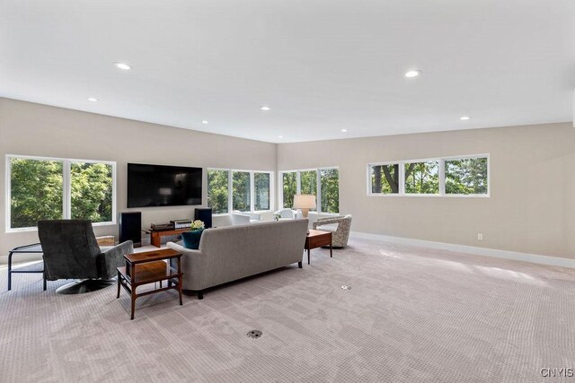 3 Elson Ln, Skaneateles, NY 13152 - living room featuring light colored carpet, plenty of natural light, recessed lighting, and baseboards