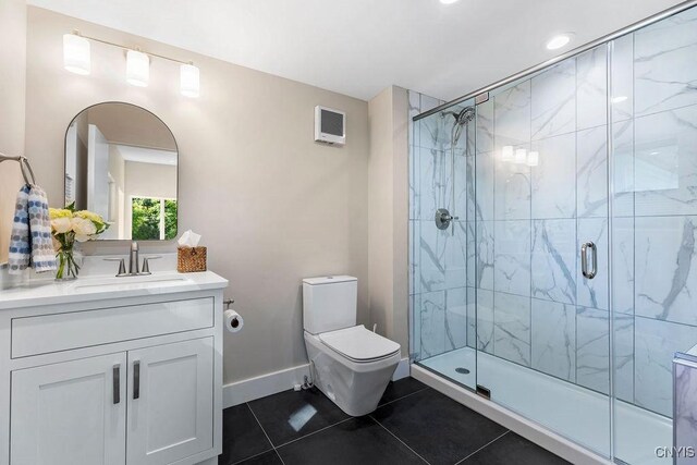 3 Elson Ln, Skaneateles, NY 13152 - full bath with tile patterned floors, vanity, a shower stall, toilet, and baseboards