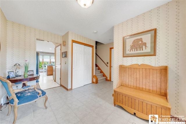 7080 Goodrich Rd, Clarence, NY 14032 - entrance foyer featuring wallpapered walls and stairway