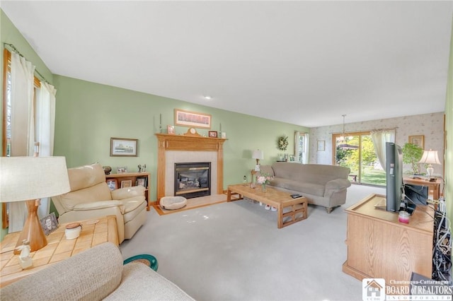 7080 Goodrich Rd, Clarence, NY 14032 - living area featuring a glass covered fireplace and carpet floors