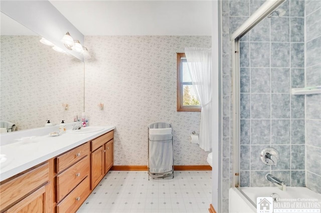 7080 Goodrich Rd, Clarence, NY 14032 - full bathroom with double vanity, shower / tub combination, tile patterned floors, wallpapered walls, and toilet