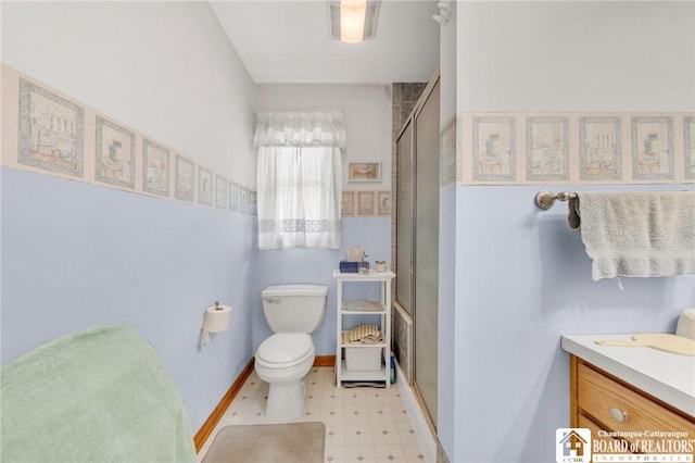 7080 Goodrich Rd, Clarence, NY 14032 - full bathroom with tile patterned floors, a shower with shower door, vanity, and toilet