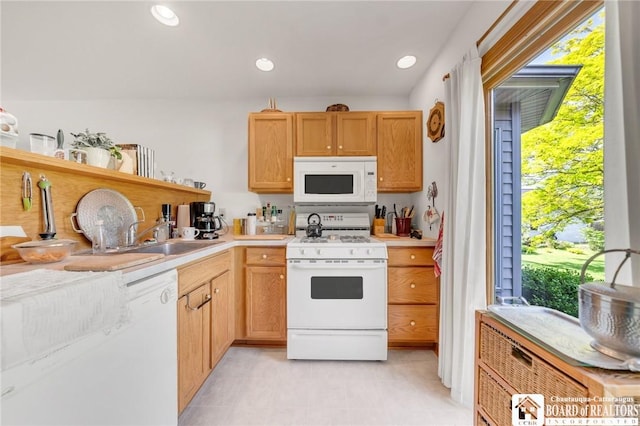 7080 Goodrich Rd, Clarence, NY 14032 - kitchen with white appliances, a sink, light countertops, and recessed lighting