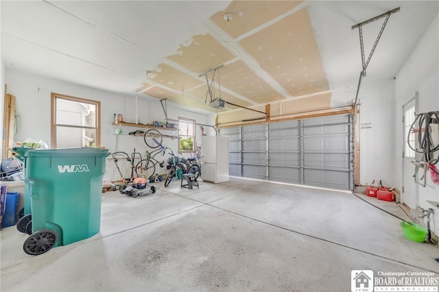 7080 Goodrich Rd, Clarence, NY 14032 - garage featuring a garage door opener