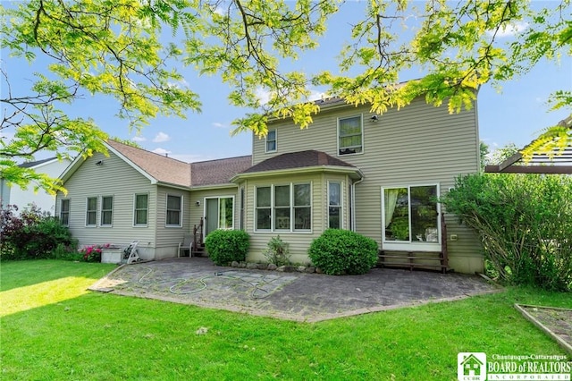 7080 Goodrich Rd, Clarence, NY 14032 - back of property featuring entry steps, a patio, and a lawn