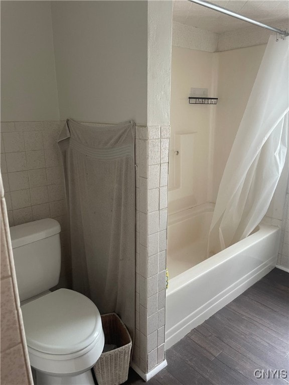61 2nd St, German Flatts, NY 13357 - bathroom featuring shower / tub combo and wood finished floors