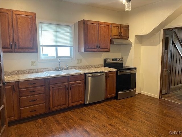 61 2nd St, German Flatts, NY 13357 - kitchen with stainless steel appliances, under cabinet range hood, light countertops, and dark wood finished floors