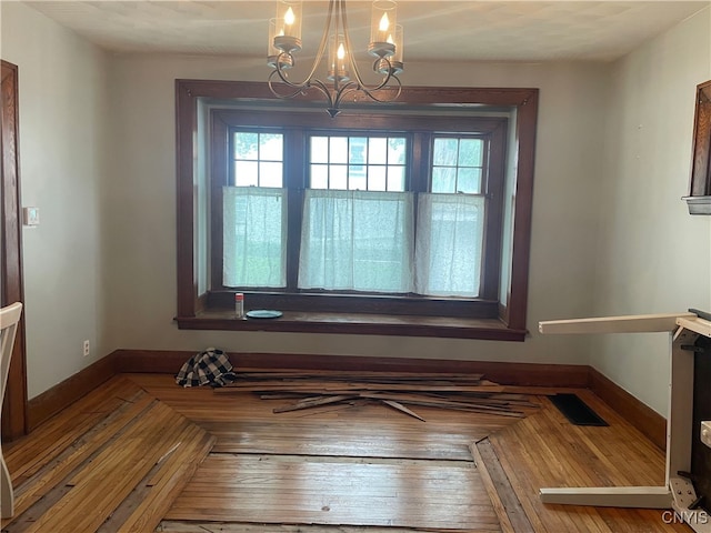 61 2nd St, German Flatts, NY 13357 - unfurnished dining area featuring healthy amount of natural light and a chandelier