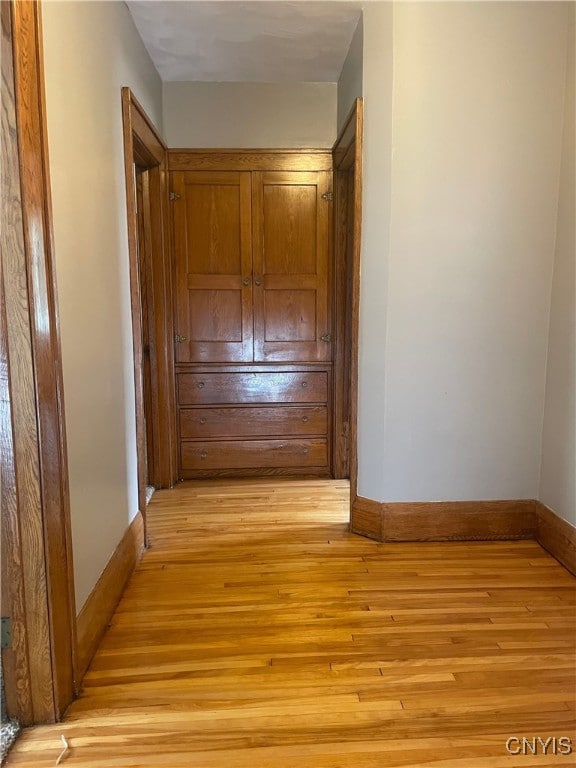 61 2nd St, German Flatts, NY 13357 - hallway with light wood-type flooring and baseboards