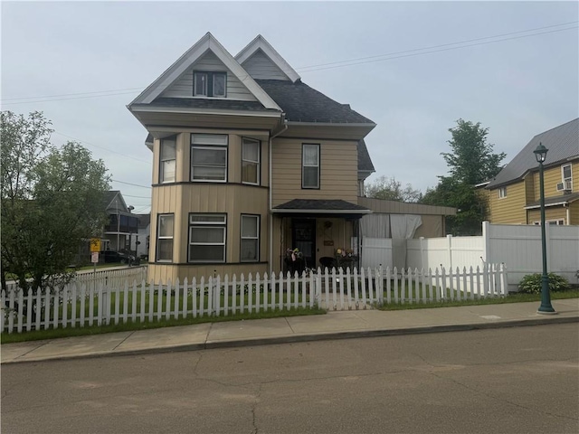 14 Park St, Bradford-City, PA 16701 - victorian house with a fenced front yard and a shingled roof