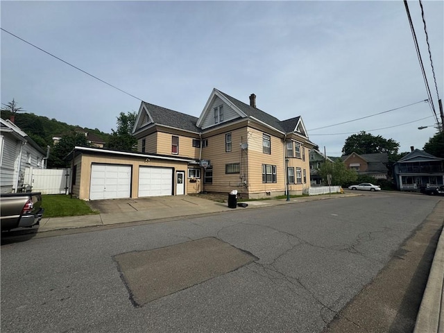 14 Park St, Bradford-City, PA 16701 - view of front of home with a garage and a chimney
