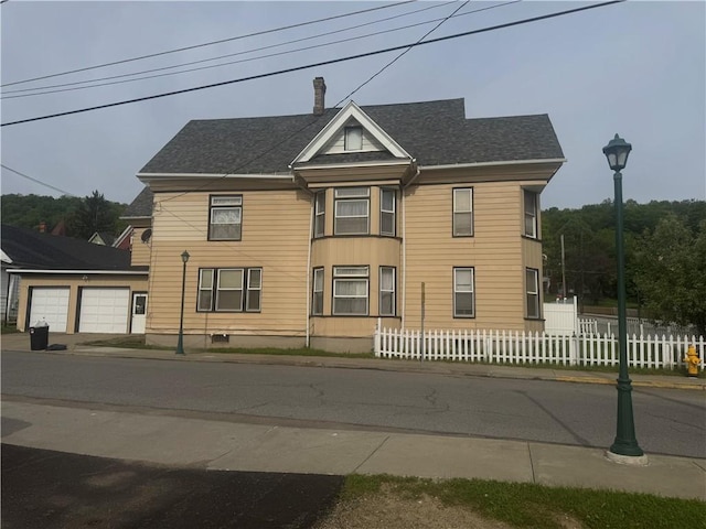 14 Park St, Bradford-City, PA 16701 - view of front of home with roof with shingles and a garage
