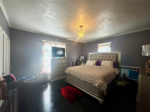14 Park St, Bradford-City, PA 16701 - bedroom with ornamental molding, dark wood-style flooring, and a textured ceiling