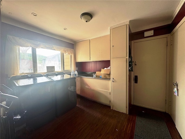 14 Park St, Bradford-City, PA 16701 - kitchen with dark wood-type flooring, white cabinetry, washer / clothes dryer, and crown molding