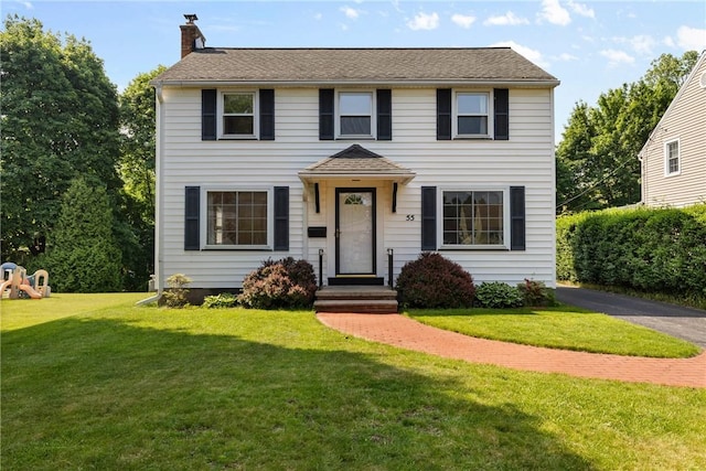 55 Heberton Rd, Irondequoit, NY 14622 - colonial inspired home featuring a chimney, a front lawn, and roof with shingles