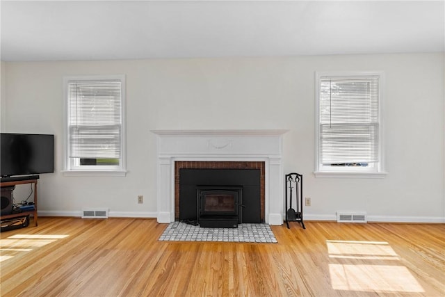 55 Heberton Rd, Irondequoit, NY 14622 - unfurnished living room with light wood finished floors, healthy amount of natural light, and baseboards
