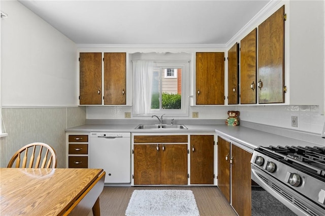 55 Heberton Rd, Irondequoit, NY 14622 - kitchen featuring dishwasher, a sink, gas range, light countertops, and dark wood-style floors