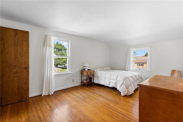 55 Heberton Rd, Irondequoit, NY 14622 - bedroom featuring light wood-style flooring, multiple windows, baseboards, and lofted ceiling