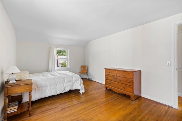 55 Heberton Rd, Irondequoit, NY 14622 - bedroom featuring wood finished floors, lofted ceiling, and baseboards