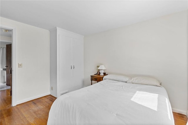55 Heberton Rd, Irondequoit, NY 14622 - bedroom with light wood-type flooring, a closet, and baseboards