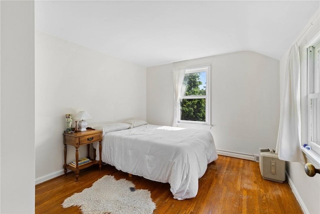 55 Heberton Rd, Irondequoit, NY 14622 - bedroom featuring vaulted ceiling, wood finished floors, a baseboard heating unit, and baseboards