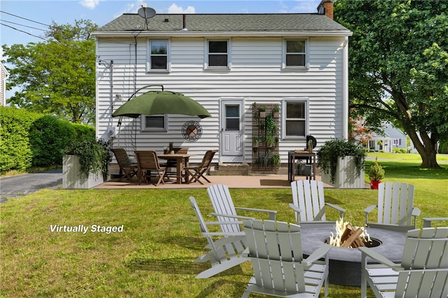 55 Heberton Rd, Irondequoit, NY 14622 - back of property featuring a fire pit, a patio area, a lawn, and a chimney