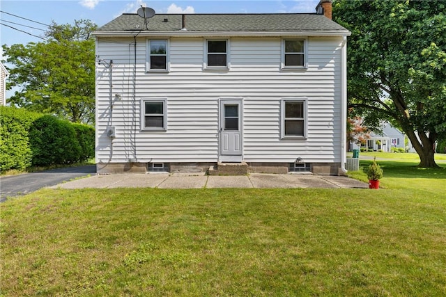 55 Heberton Rd, Irondequoit, NY 14622 - back of property with a yard, a patio, and a chimney