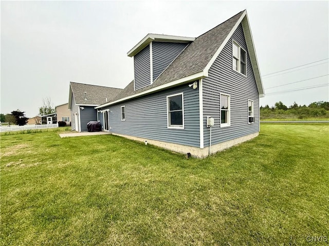 25003 State Route 37, Pamelia, NY 13601 - rear view of property featuring a lawn and a shingled roof